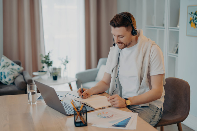 Man Makes Notes While Listening